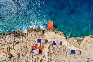 an aerial view of a cliff with the ocean at Meis Exclusive Hotel in Kaş