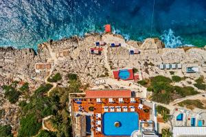 an aerial view of a mountain with the ocean at Meis Exclusive Hotel in Kaş