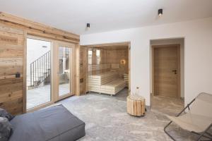 a living room with a couch and a table at Haus Sonnblick Chalet in Reith im Alpbachtal