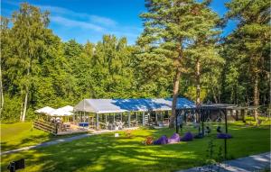 a park with a playground and a building at Nice Home In Frombork With Outdoor Swimming Pool, Wifi And 1 Bedrooms in Frombork