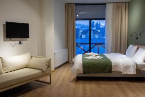 Voodi või voodid majutusasutuse Hotel 1700 toas