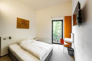 Postel nebo postele na pokoji v ubytování Hotel SKI