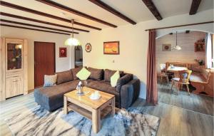 a living room with a couch and a table at 2 Bedroom Beautiful Apartment In Arrach in Arrach
