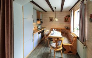 a small kitchen with a table and a couch in a room at 2 Bedroom Beautiful Apartment In Arrach in Arrach