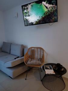 a living room with a couch and a table at ST. CLARA OLD TOWN in Šibenik