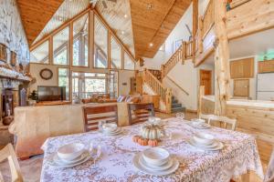 a dining room with a table and chairs and a living room at 077 - Lucky 7s - Meredith Lodging in Big Bear Lake