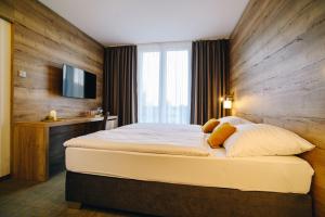 Postel nebo postele na pokoji v ubytování Hotel SKI