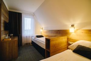 Postel nebo postele na pokoji v ubytování Hotel SKI