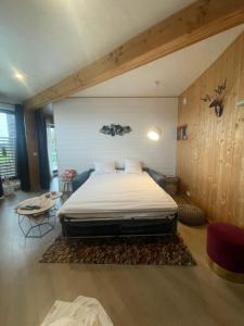 a bedroom with a large bed in a room at La Huche in Namur