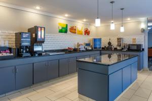 a fast food restaurant with a blue counter top at Quality Inn Fayetteville near Fort Bragg in Fayetteville