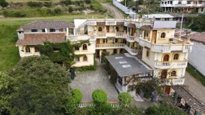 an aerial view of a large house at Hostal Curiñan in Otavalo
