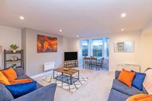 a living room with a couch and a table at Prescott Court by Guestz in Halifax