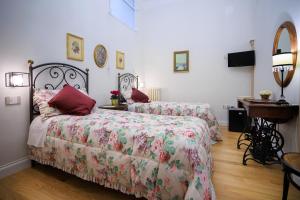 Postel nebo postele na pokoji v ubytování B&B CORSO VITTORIO