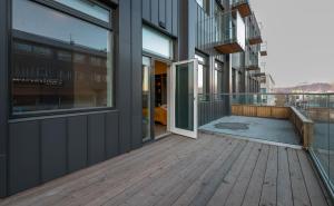 a balcony of a building with a wooden deck at Center apartments - Hekla in Reykjavík