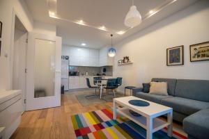 a living room with a couch and a table at Apartman Mango & Mia in Trebinje