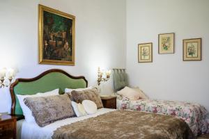 Postel nebo postele na pokoji v ubytování B&B CORSO VITTORIO