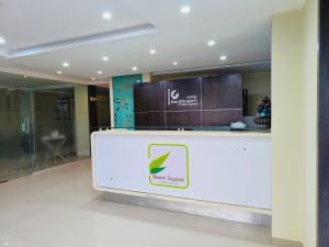 a reception desk in a lobby of a building at SAI SRUSHTI by NEEM SQUARE in Shirdi