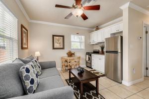 a living room with a couch and a refrigerator at Walkable to Restaurants and Steps to the Beach! - Coconut Villa's Suite 10 in St Pete Beach