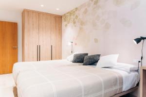 Ένα ή περισσότερα κρεβάτια σε δωμάτιο στο APARTHOTEL SALBURUA