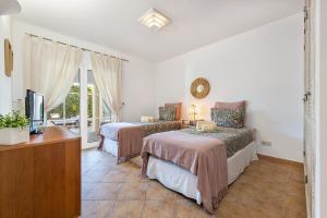 Ένα ή περισσότερα κρεβάτια σε δωμάτιο στο Villa Dome by OCvillas +52 φωτογραφίες