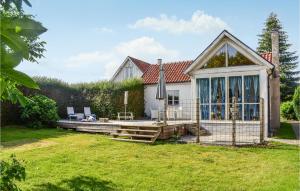 a house with a deck and a patio at 2 Bedroom Beautiful Home In Smedstorp in Smedstorp