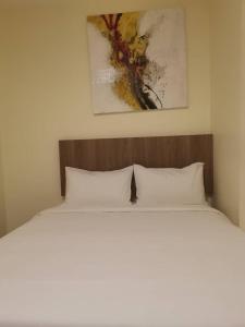 Postel nebo postele na pokoji v ubytování SCC Hotel Chinatown