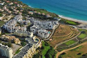 an aerial view of a resort next to the ocean at Belmar Spa & Beach Resort in Lagos