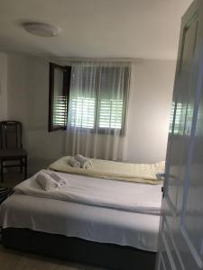 Ένα ή περισσότερα κρεβάτια σε δωμάτιο στο VILA ZORICA +33 φωτογραφίες