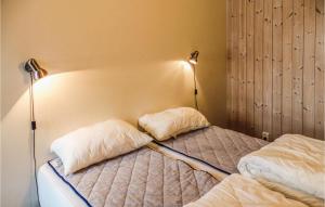 a bedroom with a bed with two pillows on it at Nice Apartment In Hemsedal With 2 Bedrooms, Sauna And Wifi in Hemsedal