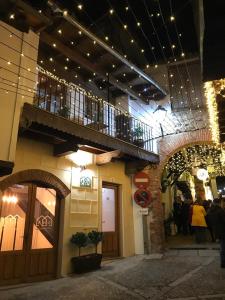 a building with a balcony on the side of it at ANJ Alojamientos in Guadalupe