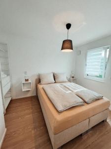 Postel nebo postele na pokoji v ubytování Black Forest Apartments