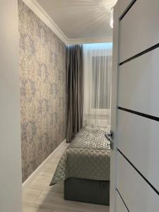 Łóżko lub łóżka w pokoju w obiekcie Jurata Apartament Glamour