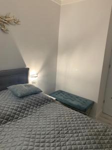 Łóżko lub łóżka w pokoju w obiekcie Jurata Apartament Glamour