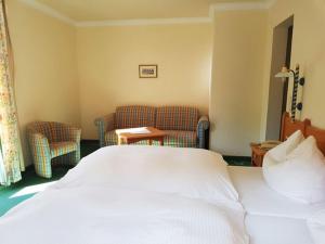 Letto o letti in una camera di Hotel Voglauerhof