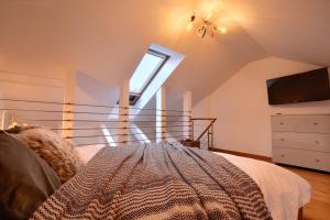 Posteľ alebo postele v izbe v ubytovaní Apartament Pistacjowy