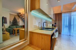 Kuchyňa alebo kuchynka v ubytovaní Apartament Pistacjowy + 19 fotografií