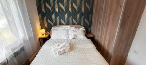 Postel nebo postele na pokoji v ubytování Vikend kuća Planinski raj