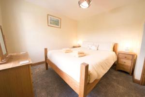 Katil atau katil-katil dalam bilik di Beckside Cottage Coniston