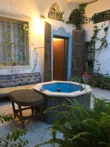 a hot tub in the courtyard of a house at Al Mutran Guest House in Nazareth