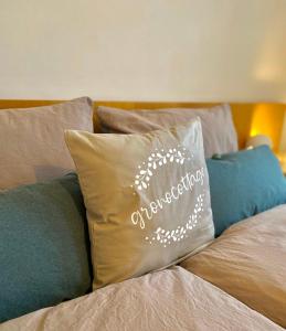 a pillow with congratulations written on it sitting on a bed at Gronocottage in Bad Harzburg