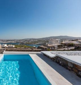 a swimming pool with a view of a city at Huge villa Mykonos. Ideal for 8-12 guests in Mýkonos City
