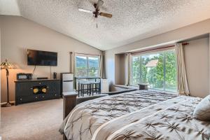 a bedroom with a bed and a large window at A Colorado Room With a View - King in Colorado Springs