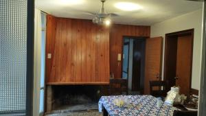 a dining room with a table and a fireplace at hoStel 3B Hab Central Baño Privado externo y Aire ac in Salto