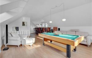 a living room with a pool table in it at 3 Bedroom Amazing Home In Frederikshavn in Frederikshavn
