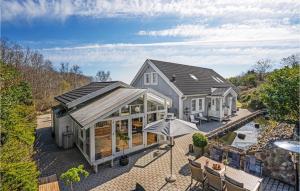 an aerial view of a house with a conservatory at 3 Bedroom Amazing Home In Frederikshavn in Frederikshavn