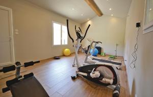 a gym with two exercise bikes in a room at Le Clos De Rosa in Crillon-le-Brave