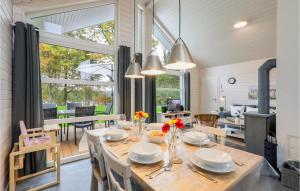 a dining room and living room with a table and chairs at Beautiful Home In Krems Ii-warderbrck With Sauna in Göls