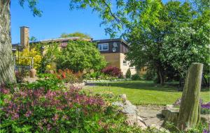 a house with a garden in front of it at 5 Bedroom Cozy Home In Hasle in Hasle +28 photos