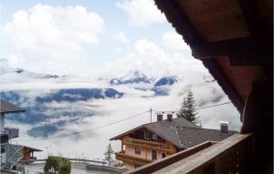 a view of a snow covered mountain from a house at Stunning Home In Hippach-schwendberg With Wifi And 5 Bedrooms in Grün