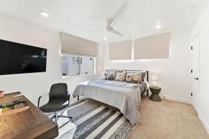 a bedroom with a bed and a desk at Modern Upscale Townhouse in Park City in Park City